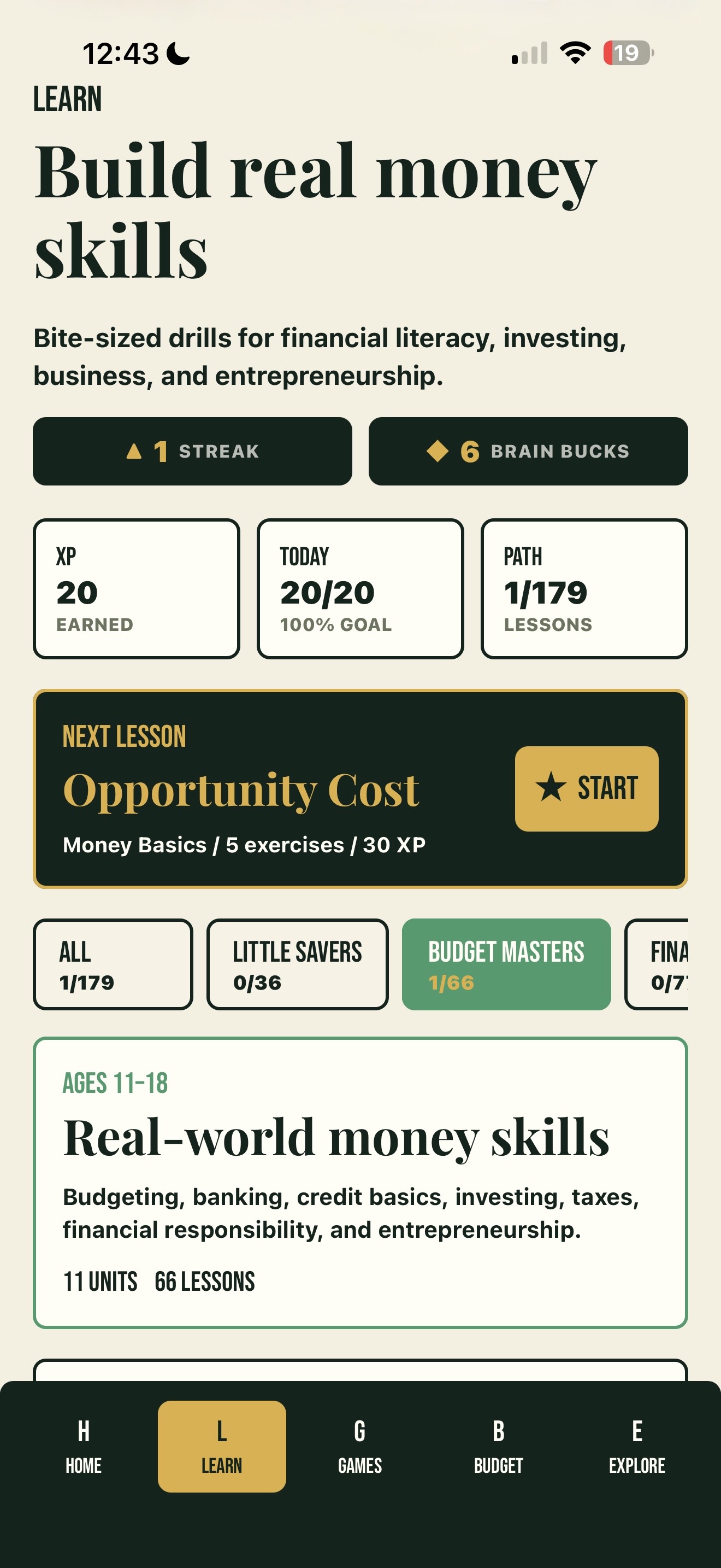 The Coinly Learn tab: XP and streak stats, the next lesson, and tracks tuned for ages 11 to 18.